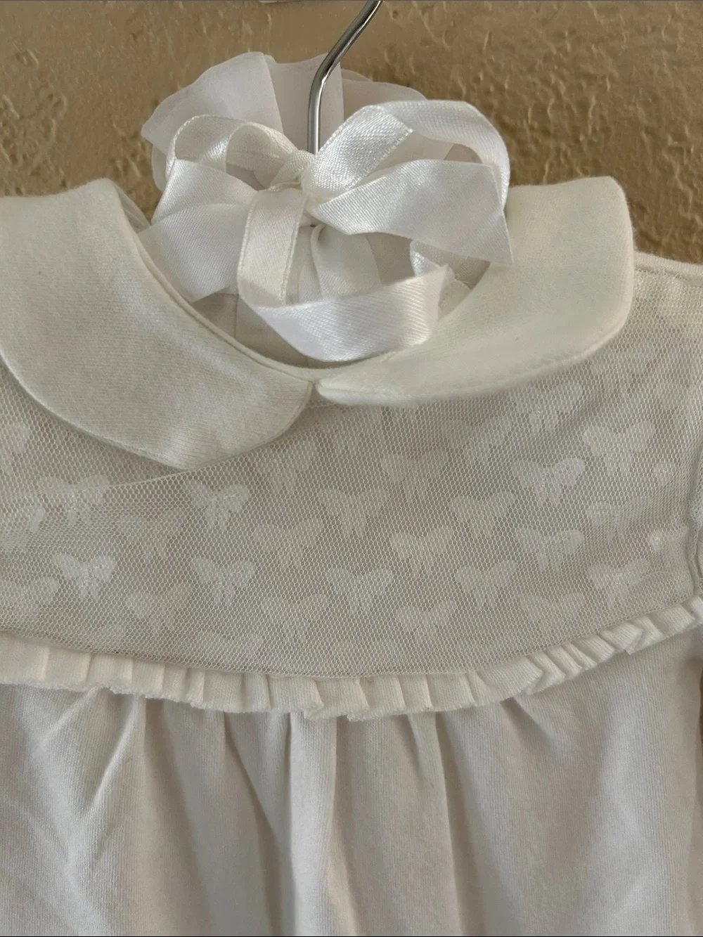 Edgehill Collection Ivory Footed Baby One-Piece with bow detail. NB